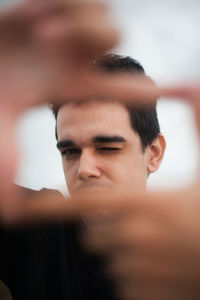 Portrait of young man gesturing