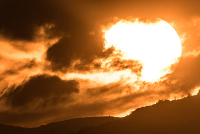 Low angle view of dramatic sky during sunset