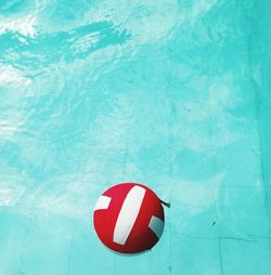 High angle view of arrow sign on swimming pool