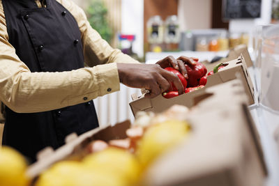 Midsection of man preparing food