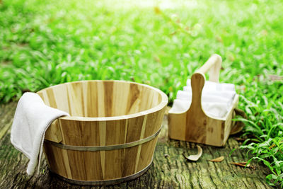 Close-up of tea cup on grass in field