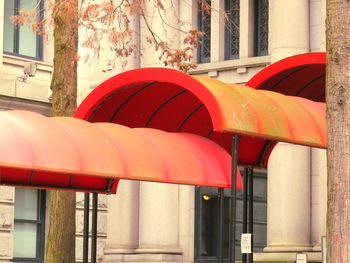 Close-up of red pipe against building