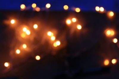 Defocused image of illuminated lights at night
