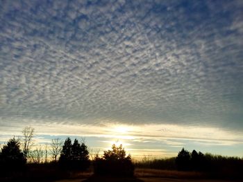 Scenic view of landscape against cloudy sky