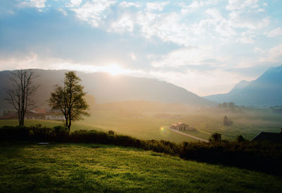 Scenic view of landscape against cloudy sky