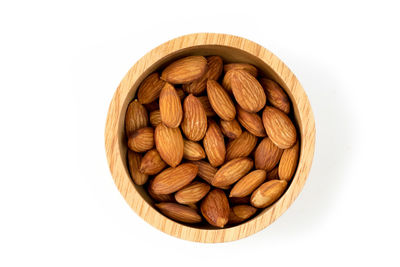 Directly above shot of bread in bowl against white background