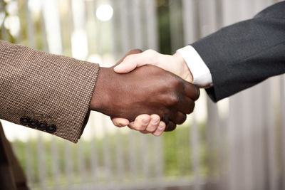 Cropped image of business people shaking hands