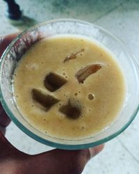 Close-up of hand holding coffee