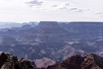 Scenic view of rocky mountains against sky on sunny day at grand canyon national park