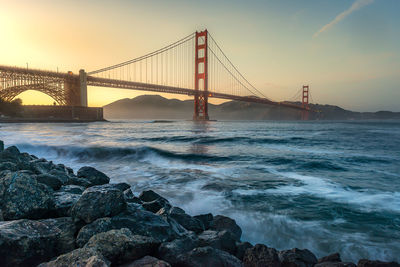 View of suspension bridge over sea