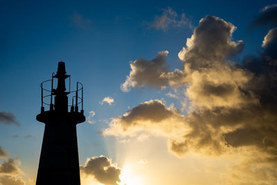 Silhouette of people enjoying the sunset at ponta do humaita.