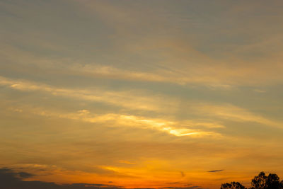 Low angle view of dramatic sky during sunset