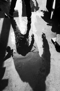 Low section of people standing on street