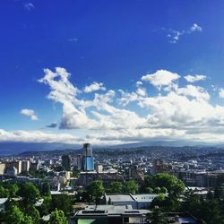 Aerial view of cityscape against sky