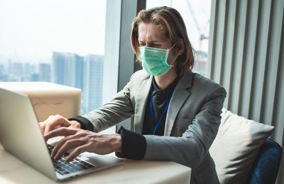 Man using laptop on table