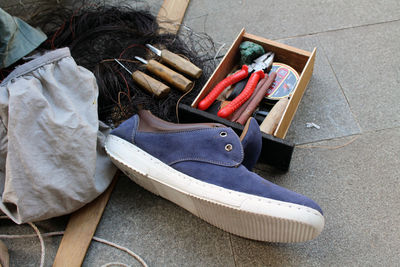 High angle view of various shoes on floor