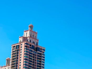 Low angle view of building against blue sky