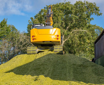 Agricultural machinery tractor and chopper during the corn harvest