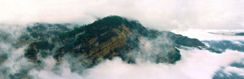 Scenic view of waterfall against sky during winter