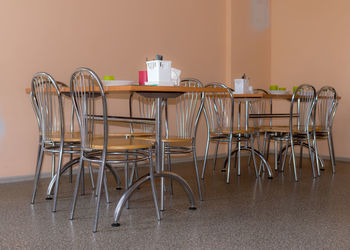 School kitchen canteen, metal table and chair legs, canteen equipment, catering establishment