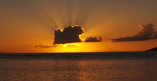 Scenic view of sea against orange sky