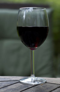 Close-up of red wine in glass on table