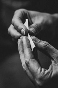 Close-up of man holding hands