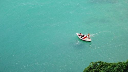 High angle view of people on boat in sea