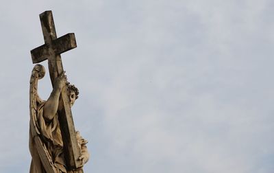 Low angle view of statue against sky