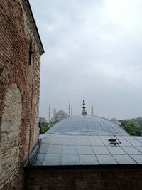 View of historic building against cloudy sky