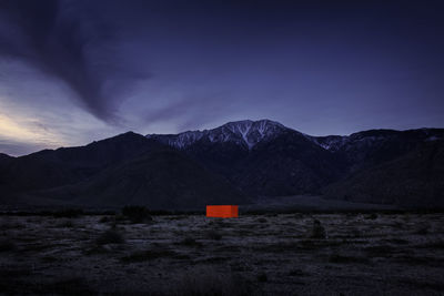 Scenic view of mountains against sky at sunset