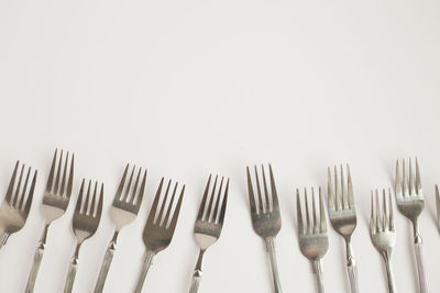 Close-up of objects on table against white background