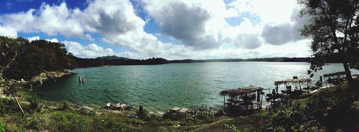 Scenic view of lake against cloudy sky