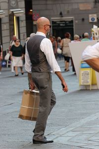 Full length of man walking on street