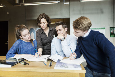 Professor teaching students in classroom