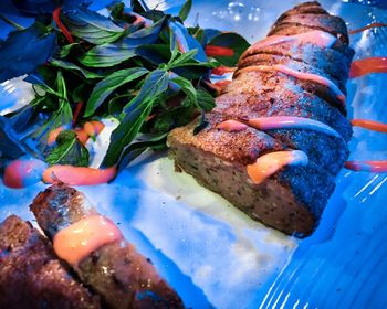 High angle view of fish on barbecue grill