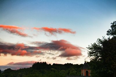 Silhouette trees against sky during sunset