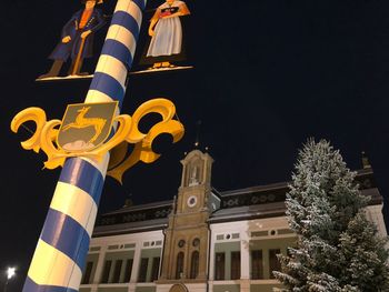 Low angle view of illuminated building at night