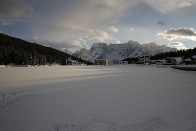 Scenic view of snow covered mountains against sky