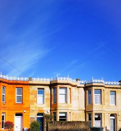 Low angle view of building against blue sky