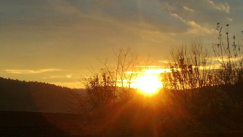 Scenic view of sunset over landscape