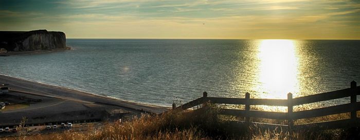 Scenic view of sea at sunset