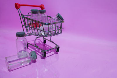 Close-up of metal equipment against pink background