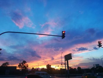 Low angle view of silhouette trees against sky during sunset