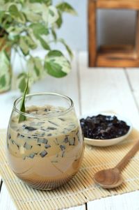 Close-up of iced black cincau on table