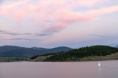 Scenic view of lake against sky during sunset