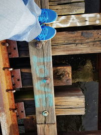 Low section of woman on wooden floor