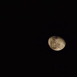 Low angle view of moon against sky at night