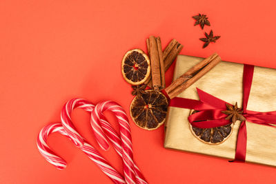 Directly above shot of christmas decorations on yellow background