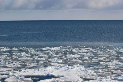 Scenic view of sea against sky during winter